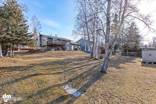 view of yard with an outbuilding and a deck