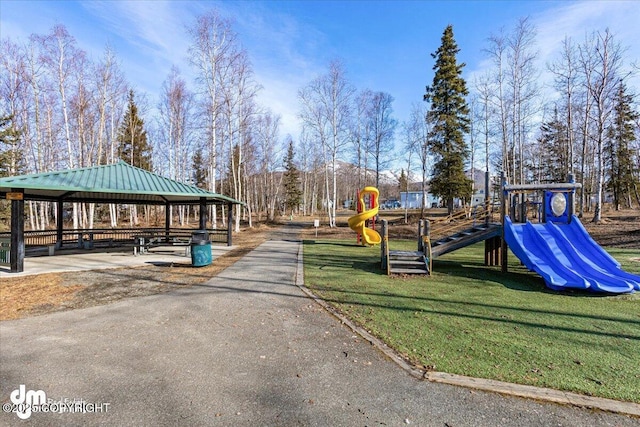 community play area featuring a gazebo and a lawn