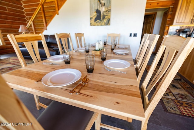 dining area featuring rustic walls