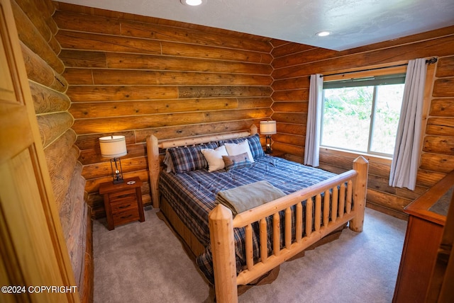 bedroom featuring carpet, rustic walls, and recessed lighting