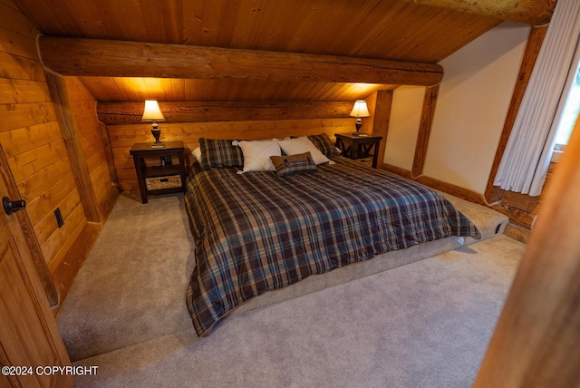 bedroom with wood walls, beamed ceiling, carpet flooring, and wood ceiling