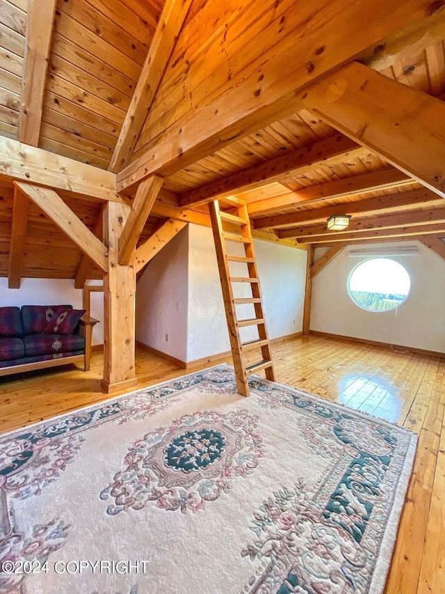 interior space with vaulted ceiling with beams, wooden ceiling, and wood-type flooring