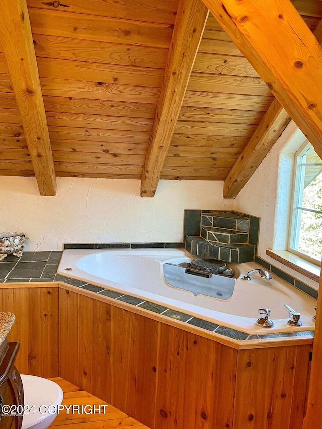 kitchen featuring brown cabinetry, wooden ceiling, and lofted ceiling with beams