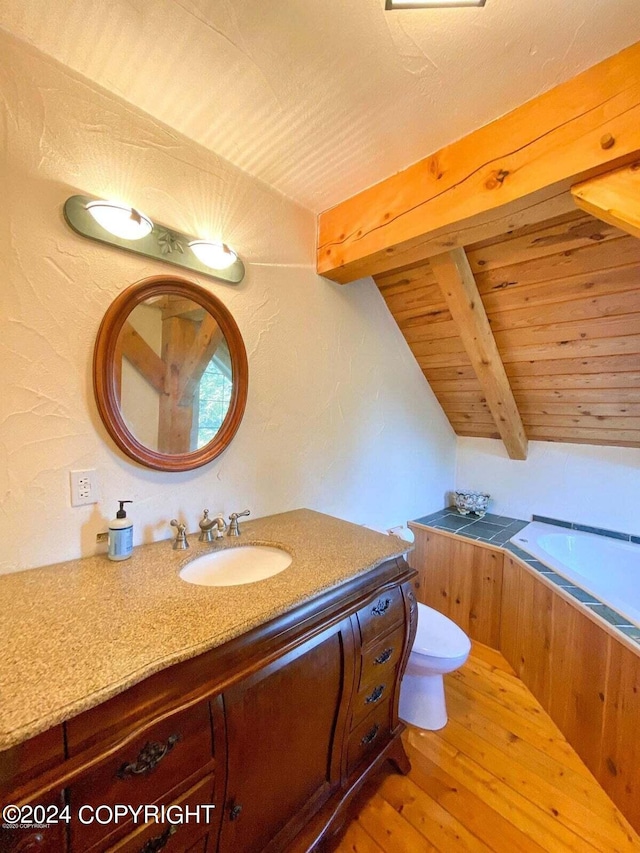 bathroom featuring vaulted ceiling with beams, wooden ceiling, wood-type flooring, and vanity