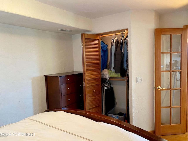 unfurnished bedroom with a closet and visible vents