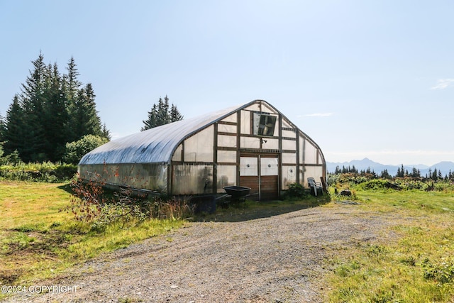 view of greenhouse featuring a mountain view