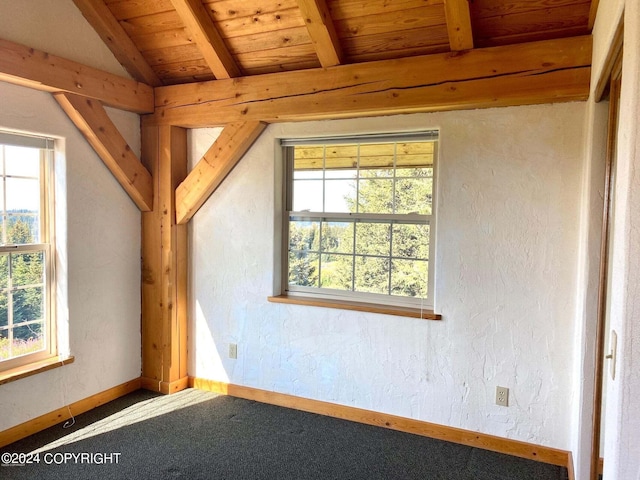 additional living space with a textured wall, wooden ceiling, vaulted ceiling with beams, and baseboards