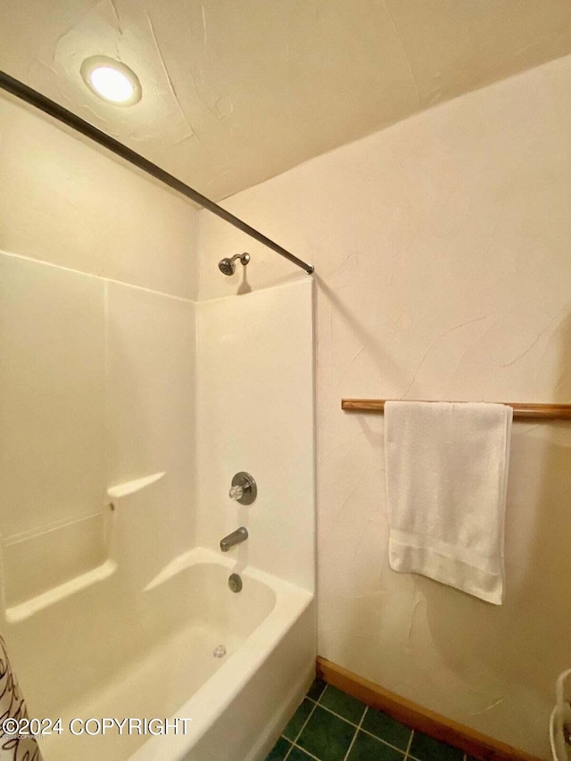 full bath featuring shower / bath combination and tile patterned flooring