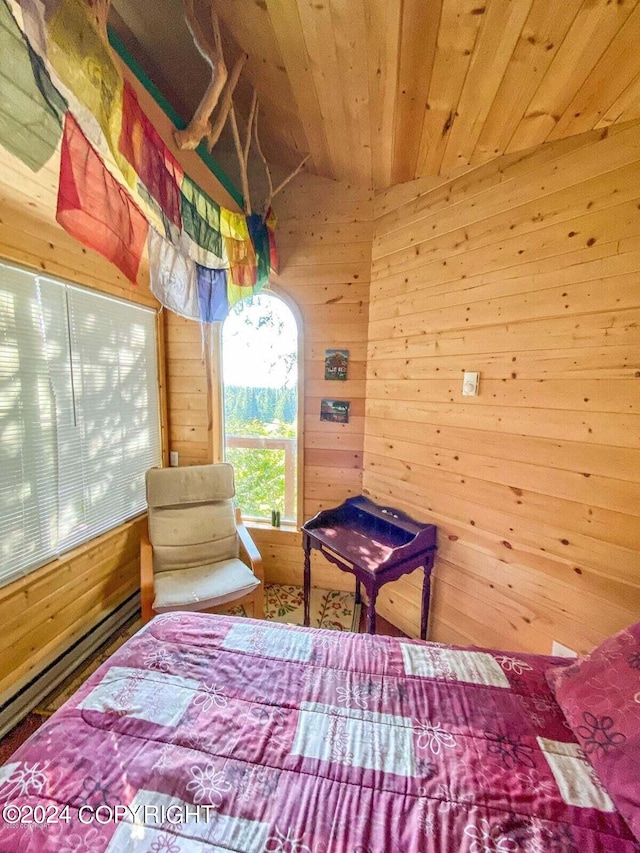 bedroom with wood walls and wood ceiling