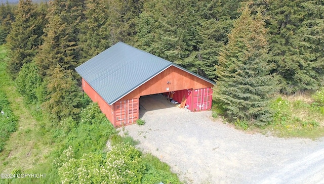 birds eye view of property with a view of trees