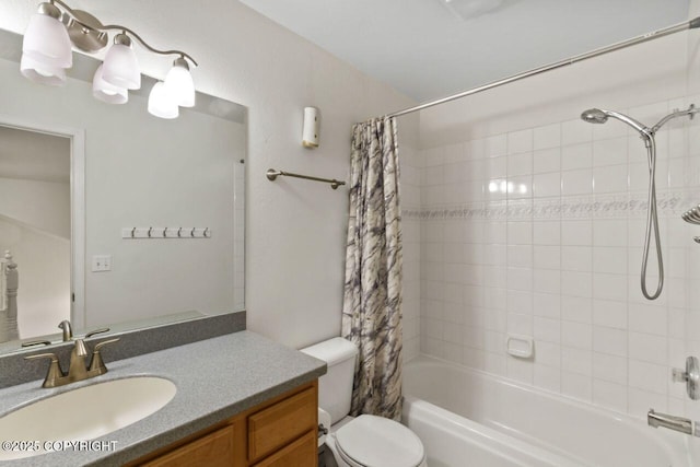 bathroom with shower / tub combo, vanity, and toilet