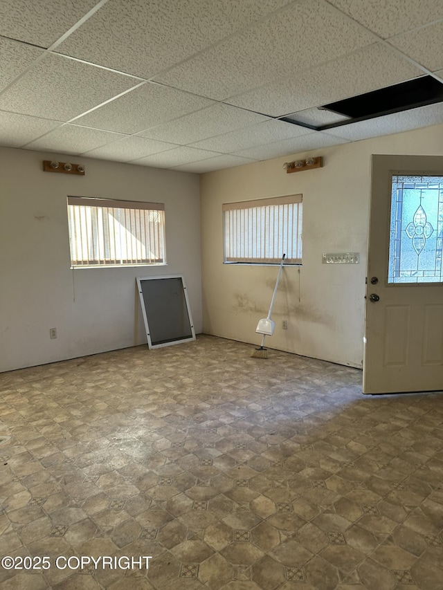 spare room featuring a paneled ceiling