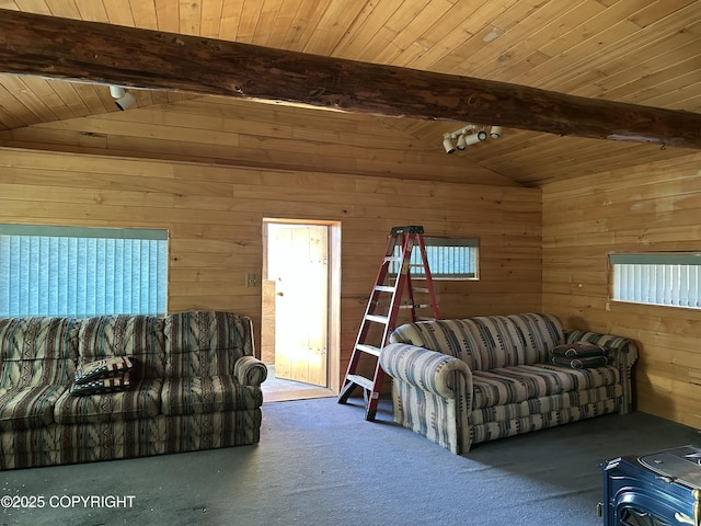 living room with lofted ceiling with beams, plenty of natural light, wood ceiling, and wooden walls