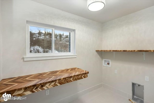 washroom featuring laundry area, washer hookup, and tile patterned floors