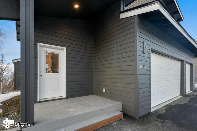 doorway to property featuring a garage