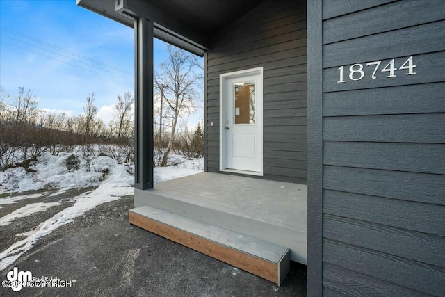 view of snow covered property entrance