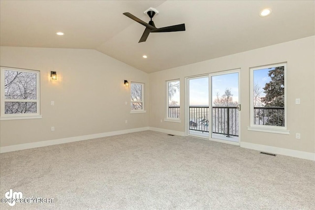 carpeted spare room featuring lofted ceiling, visible vents, and recessed lighting