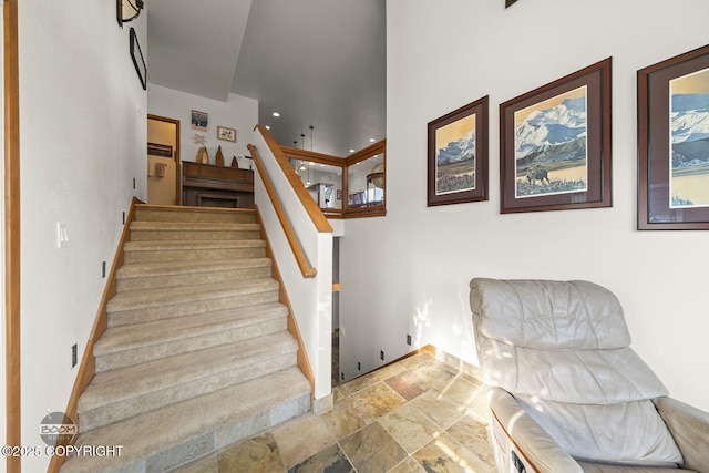 stairs featuring stone tile floors