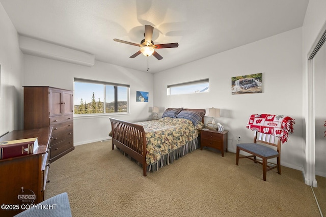 bedroom with light carpet, ceiling fan, and baseboards