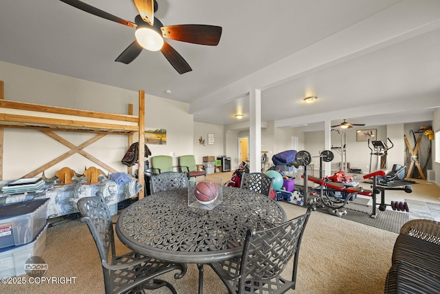 carpeted dining room with a ceiling fan