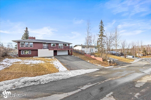 view of front of property with a garage and driveway