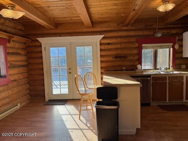 kitchen featuring french doors, light wood finished floors, a wealth of natural light, wooden ceiling, and dishwasher