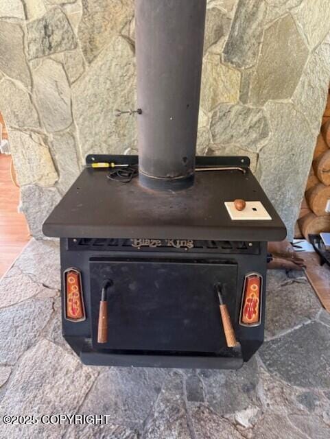 interior details featuring a wood stove