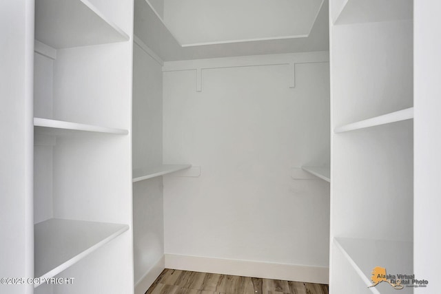 spacious closet with wood finished floors