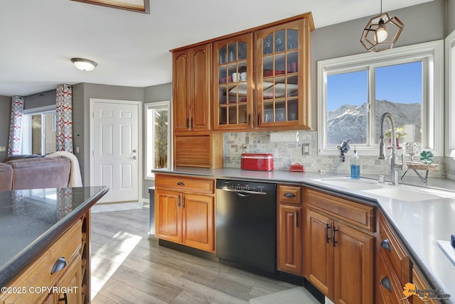 20420 Williamsburg Dr, Eagle River, AK 99577 - kitchen with dishwasher, brown cabinets, glass insert cabinets, and a sink