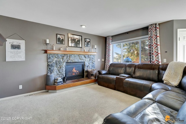 20420 Williamsburg Dr, Eagle River, AK 99577 - carpeted living area featuring a stone fireplace and baseboards