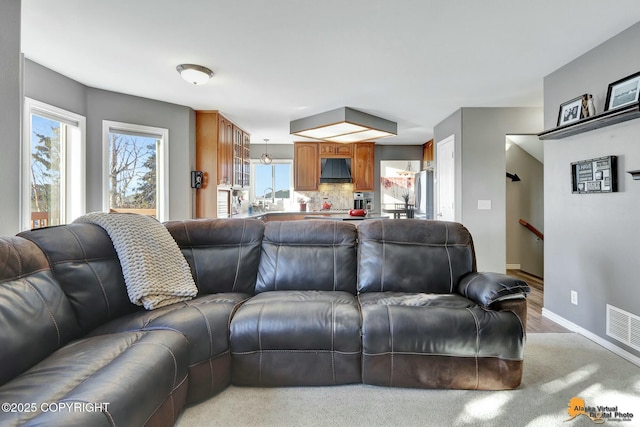 20420 Williamsburg Dr, Eagle River, AK 99577 - living area featuring light wood-type flooring and baseboards