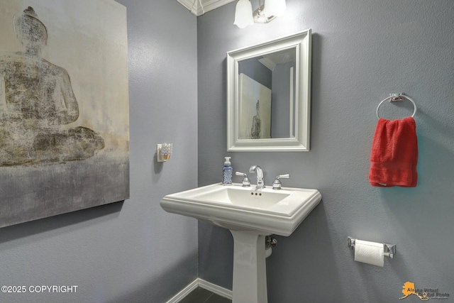 20420 Williamsburg Dr, Eagle River, AK 99577 - bathroom featuring crown molding and baseboards