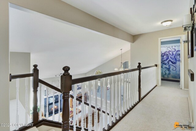 20420 Williamsburg Dr, Eagle River, AK 99577 - hallway featuring an upstairs landing, a chandelier, and carpet
