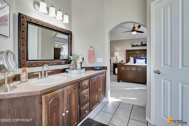 20420 Williamsburg Dr, Eagle River, AK 99577 - ensuite bathroom with a ceiling fan, double vanity, and tile patterned flooring