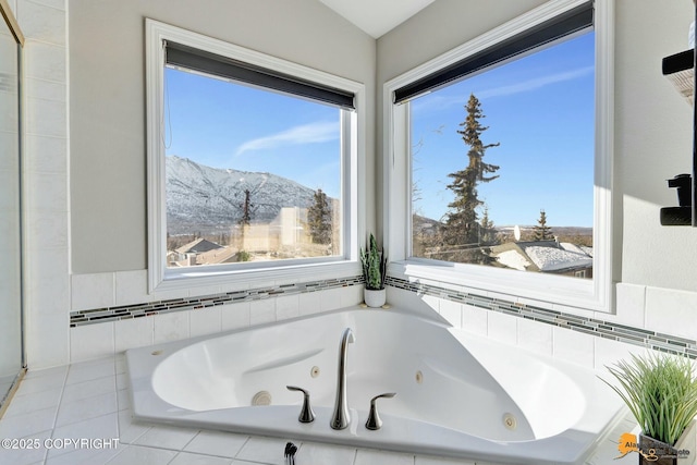 20420 Williamsburg Dr, Eagle River, AK 99577 - bathroom featuring a mountain view, a jetted tub, and healthy amount of natural light
