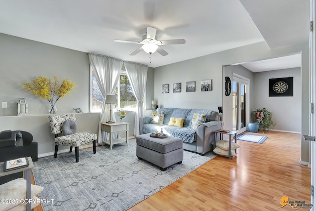 20420 Williamsburg Dr, Eagle River, AK 99577 - living room with a ceiling fan, wood finished floors, and baseboards