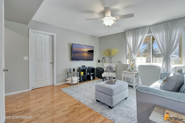 20420 Williamsburg Dr, Eagle River, AK 99577 - living area with wood finished floors, ceiling fan, and baseboards