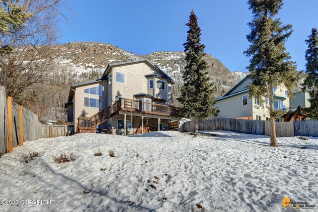 20420 Williamsburg Dr, Eagle River, AK 99577 - snow covered property with stairway and a deck with mountain view