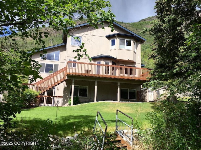 20420 Williamsburg Dr, Eagle River, AK 99577 - back of house featuring a deck, a yard, and stairs