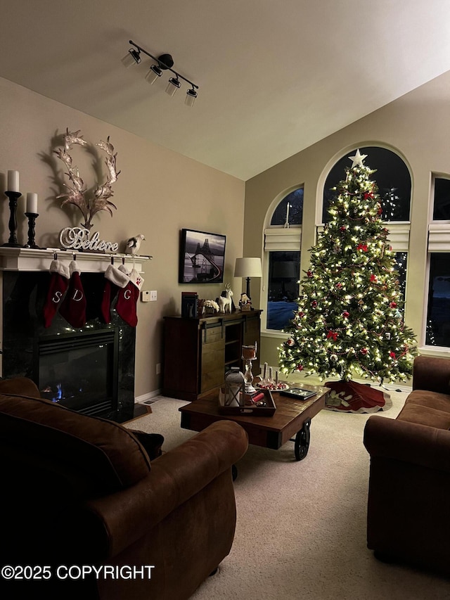 20420 Williamsburg Dr, Eagle River, AK 99577 - living area with a glass covered fireplace, carpet, and lofted ceiling