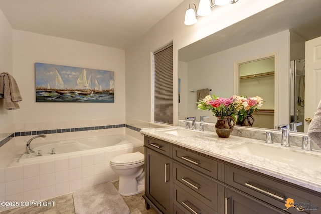 full bathroom featuring double vanity, a sink, toilet, and a bath