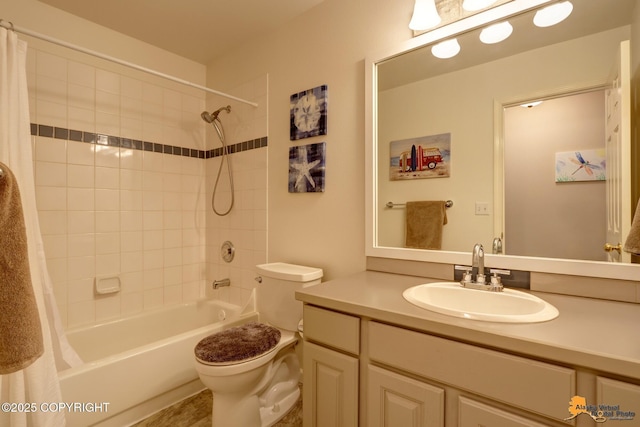 full bath with shower / bath combo, vanity, and toilet