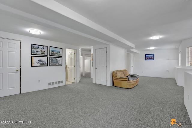 unfurnished room featuring carpet and visible vents