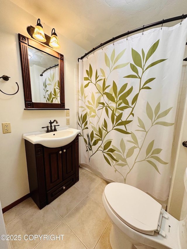 bathroom with a shower with shower curtain, toilet, vanity, tile patterned flooring, and baseboards