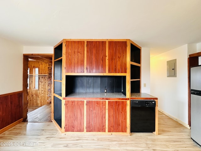 kitchen featuring open shelves, light wood-style floors, freestanding refrigerator, wood walls, and electric panel