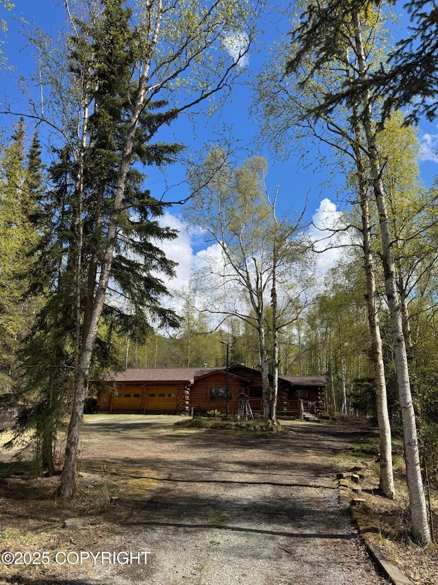 10337 Chain Of Rock St, Eagle River, AK 99577 - cabin featuring driveway