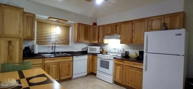 kitchen featuring dark countertops, white appliances, a sink, and under cabinet range hood