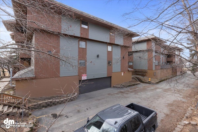 view of property with driveway