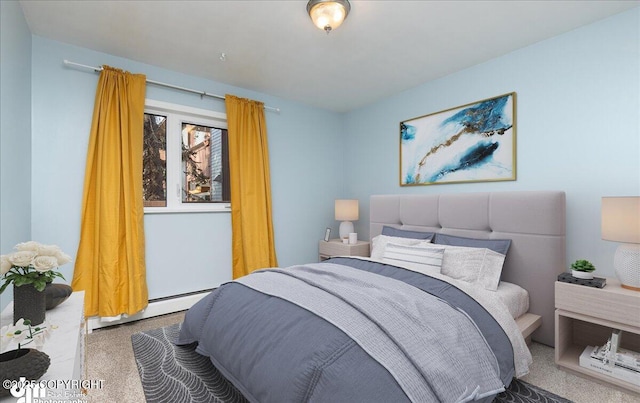 carpeted bedroom featuring a baseboard heating unit