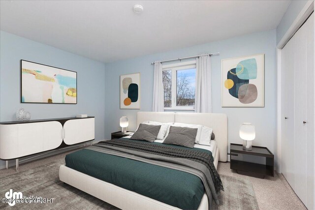 bedroom featuring a closet and carpet flooring